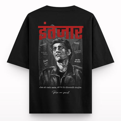 Black oversized t-shirt with a graphite-style drawing of a man, Hindi text, and bold red print.