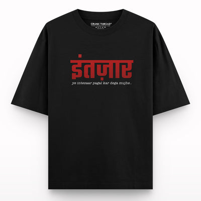 Black oversized t-shirt with Hindi text design and statement print on front
