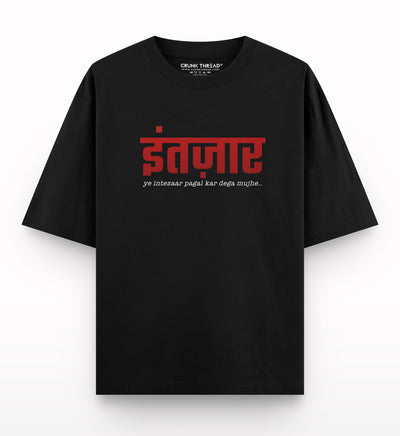Black oversized t-shirt with Hindi text design and statement print on front